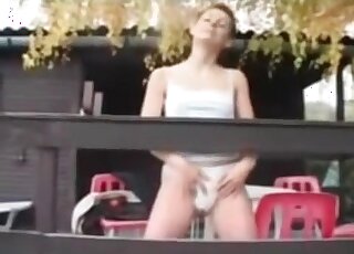 Fit wife with short hair is filmed by her partner